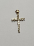  Cross pendant with embedded stones on a light gray background